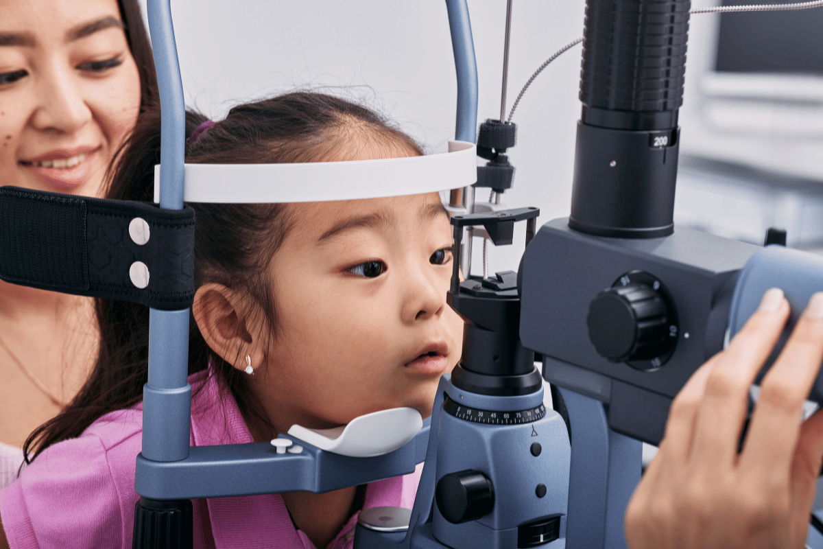 Ascension Optical February 2025 Blog Image a little girl with her mom getting an eye exam